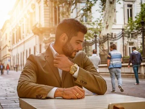 Trendy man in cafe outside Stock Photos