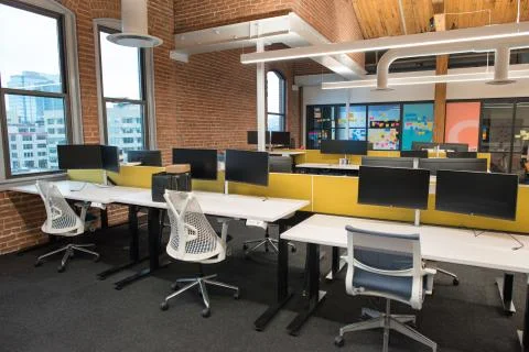 Trendy modern open concept loft office space with big windows, natural light and Stock Photos
