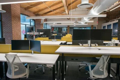 Trendy modern open concept loft office space with big windows, natural light and Stock Photos