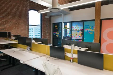 Trendy modern open concept loft office space with big windows, natural light and Stock Photos