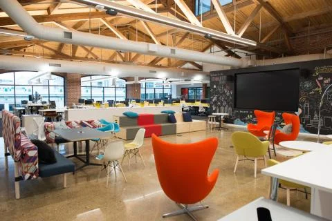 Trendy modern open concept loft office space with big windows, natural light and Stock Photos