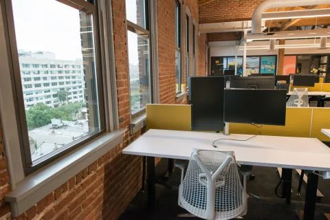 Trendy modern open concept loft office space with big windows, natural light and Stock Photos