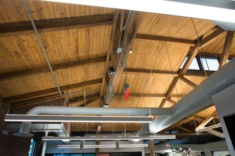 Trendy modern open concept loft office space with big windows, natural light and Stock Photos