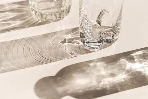 Trendy pattern made with glasses and shadows. glass with sparkling sunlight Stock Photos