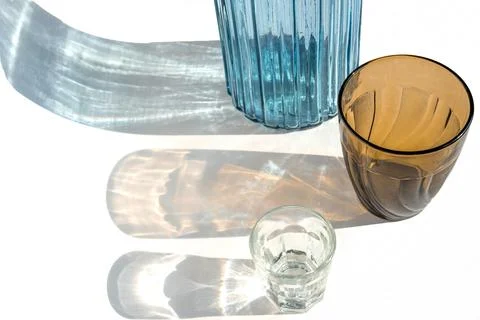 Trendy pattern made with glasses and shadows on gray white background. Sunlig Stock Photos