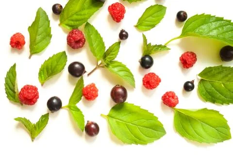 Trendy pattern with raspberries and mint and blackcurrant like background Foto stock