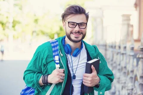 Trendy student with backpack Stock Photos