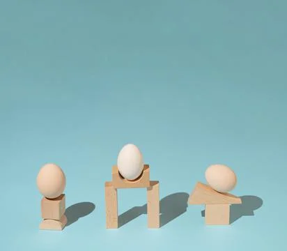 Trendy sunlight composition made with eggs and wooden geometric elements onpa Stock Photos