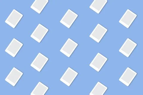 Trendy technological pattern made with white e-book on bright light blue back Foto stock