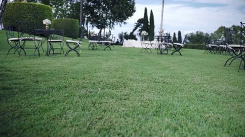 Trendy wedding setting decor in the garden, vintage round tables decorated with Video stock 159911321