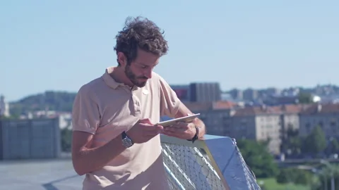Trendy young hipster using tablet outdoors Stock-Footage 132845791