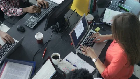Trendy young workers checking the new business results Stock Footage 73848765