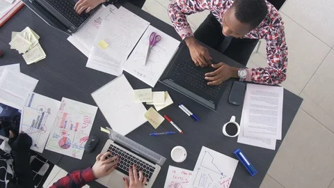 Trendy young workers checking the new business results Stock Footage 73854897