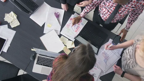 Trendy young workers discussing the new business results Stock-Footage 73855161