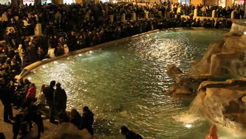 Trevi Fountain and crowd in Rome, Italy at night Stock Footage