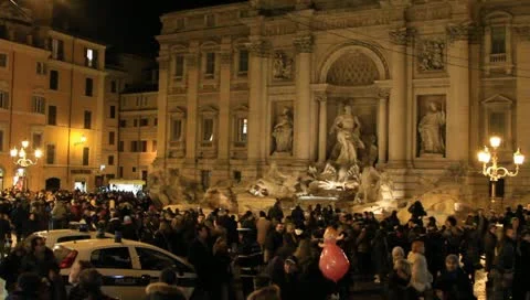 Trevi Fountain and crowd in Rome, Italy at night Stock Footage