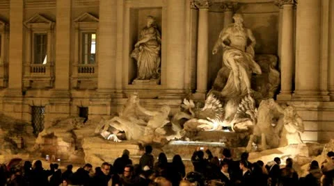 Trevi Fountain and crowd in Rome, Italy at night Stock Footage