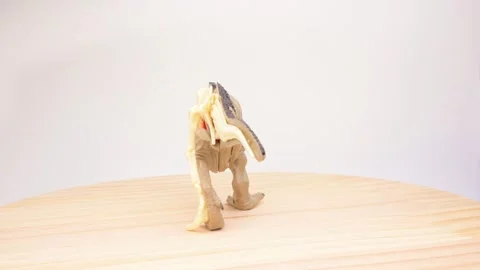 T?rex toy model showing outer skin and exposed internal skeleton rotating Stock Footage 343795299