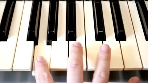 Triad on a digital keyboard close-up Stock Footage 127699969