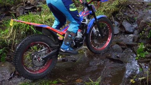 Trial bike in stream. Stock Footage 93783544