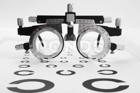 Trial frame and vision test chart isolated on white ~ Hi Res #263004463