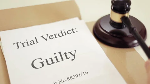 Trial verdict folder with gavel placed on desk of judge in court Stock Footage 59560305