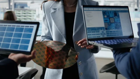 Trialing advanced materials, silicon wafer and multiethnic engineering team Stock Footage 335880677