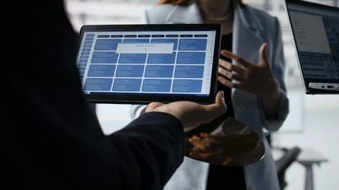 Trialing advanced materials, silicon wafer and multiethnic engineering team Stock Photos