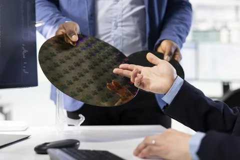 Trialling advanced materials, silicon wafer substrates close up and scientists Stock Photos