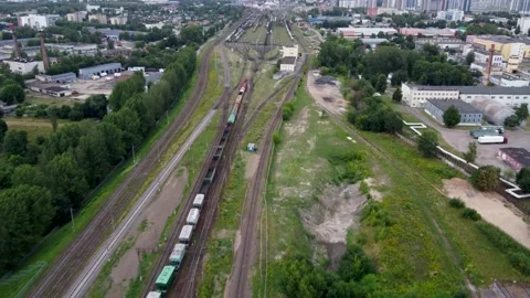 Trian approaching big sorting station, long trolley moving on it's own Stock Footage 231165037
