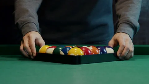Triangle Of Billiard Balls. A Man Getting Ready To Start A Game Of Billiards. Stock Footage 148317983