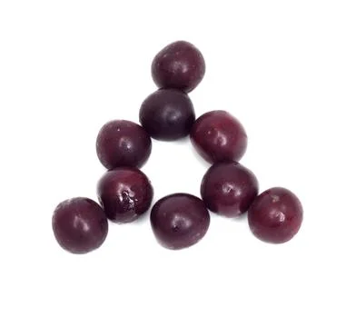 A triangle of black cherries on a white background Stock Photos