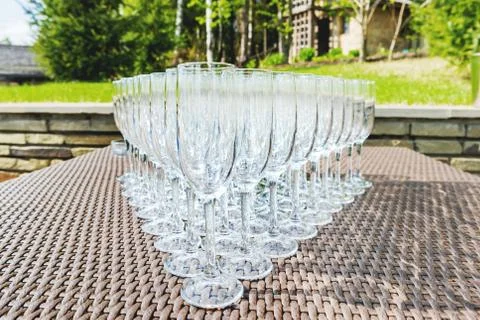 Triangle of empty wine glasses. Table with alcohol beverages for the guests.. Stock Photos