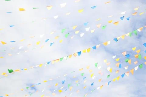 Triangle flags on wire and sky background. Foto stock