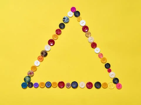 Triangle frame made of colorful buttons Stock Photos
