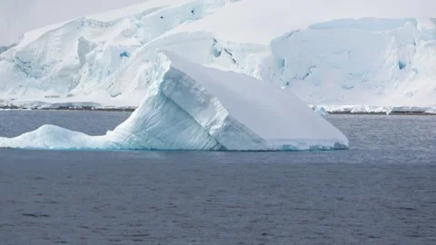 Triangle iceberg floating close-up Antarctica, 4K Stock Footage 332372870