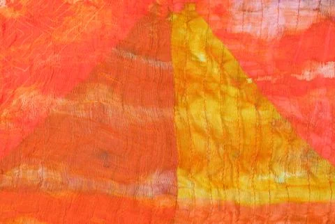 Triangle pattern on stitched orange silk batik Stock Photos