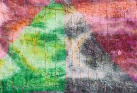 Triangle pattern on stitched silk batik Stock Photos