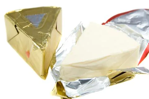 Triangle piece of cheese Stock Photos