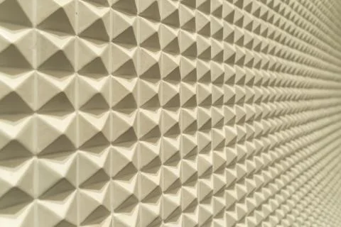 Triangle pyramid tiles pattern surface texture. Close-up of architecture inte Stock Photos
