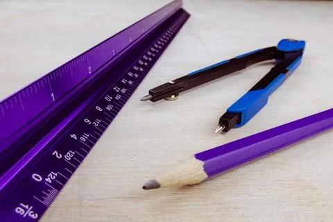 Triangle ruler comapss and pencil Lets do some work Stock Photos