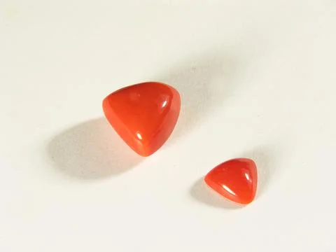 Triangle shape of coral munga gems according to astrology represents mars p.. Stock Photos
