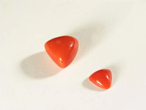Triangle shape of coral munga gems according to astrology represents mars ... Stock Photos