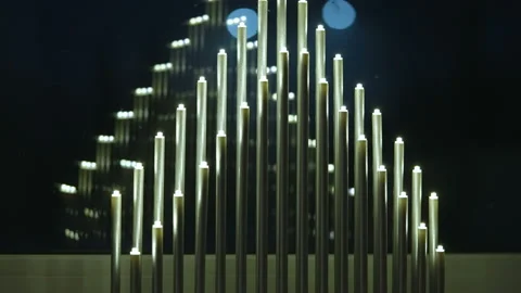 The triangle shaped candles on a tall holder in Estonia Stock Footage 146602745