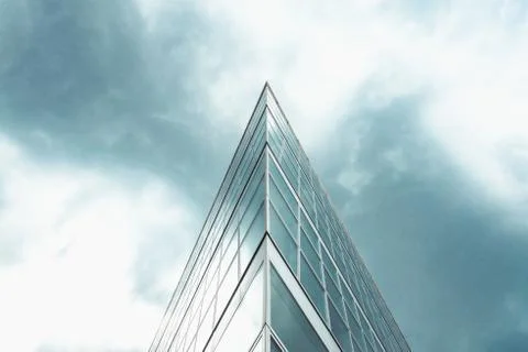 Triangle shaped structure against a blue cloudy sky. Stock Photos