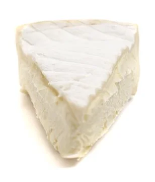 Triangle Slice of a Soft White Cheese with a Rine on a  White Background Foto stock