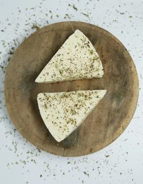 Triangles of melted cheese with spices Stock Photos