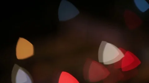 Triangular bokeh nighttime urban traffic Stock Footage 73528134