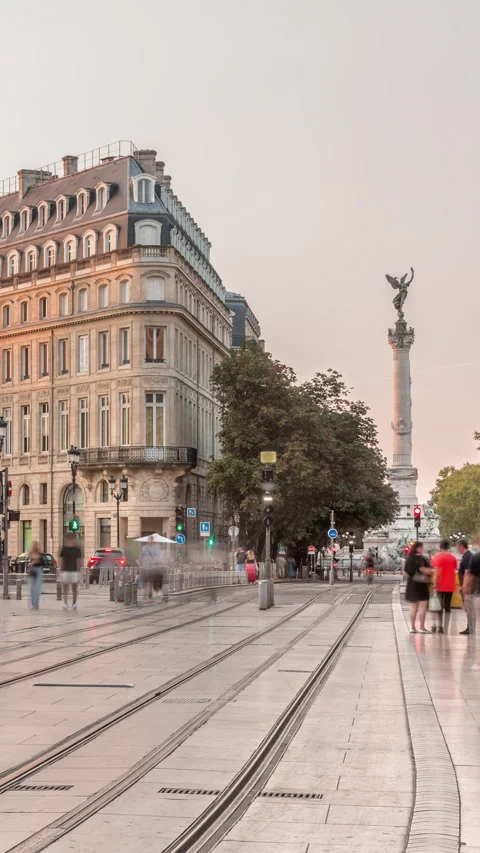 Triangular building and modern tram at Place de la Comedie timelapse Vídeos de archivo 321943203
