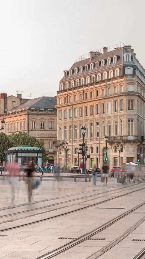 Triangular building and modern tram timelapse at Place de la Comedie, Bordeaux​ Stock Footage 325196008